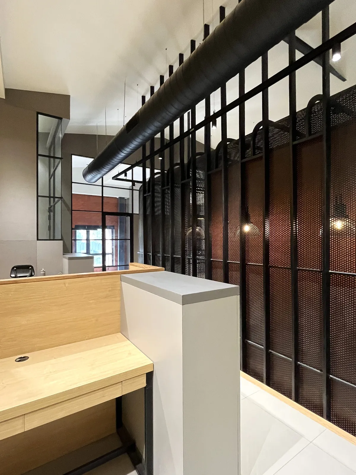 The Barn: Workstations beside the cage