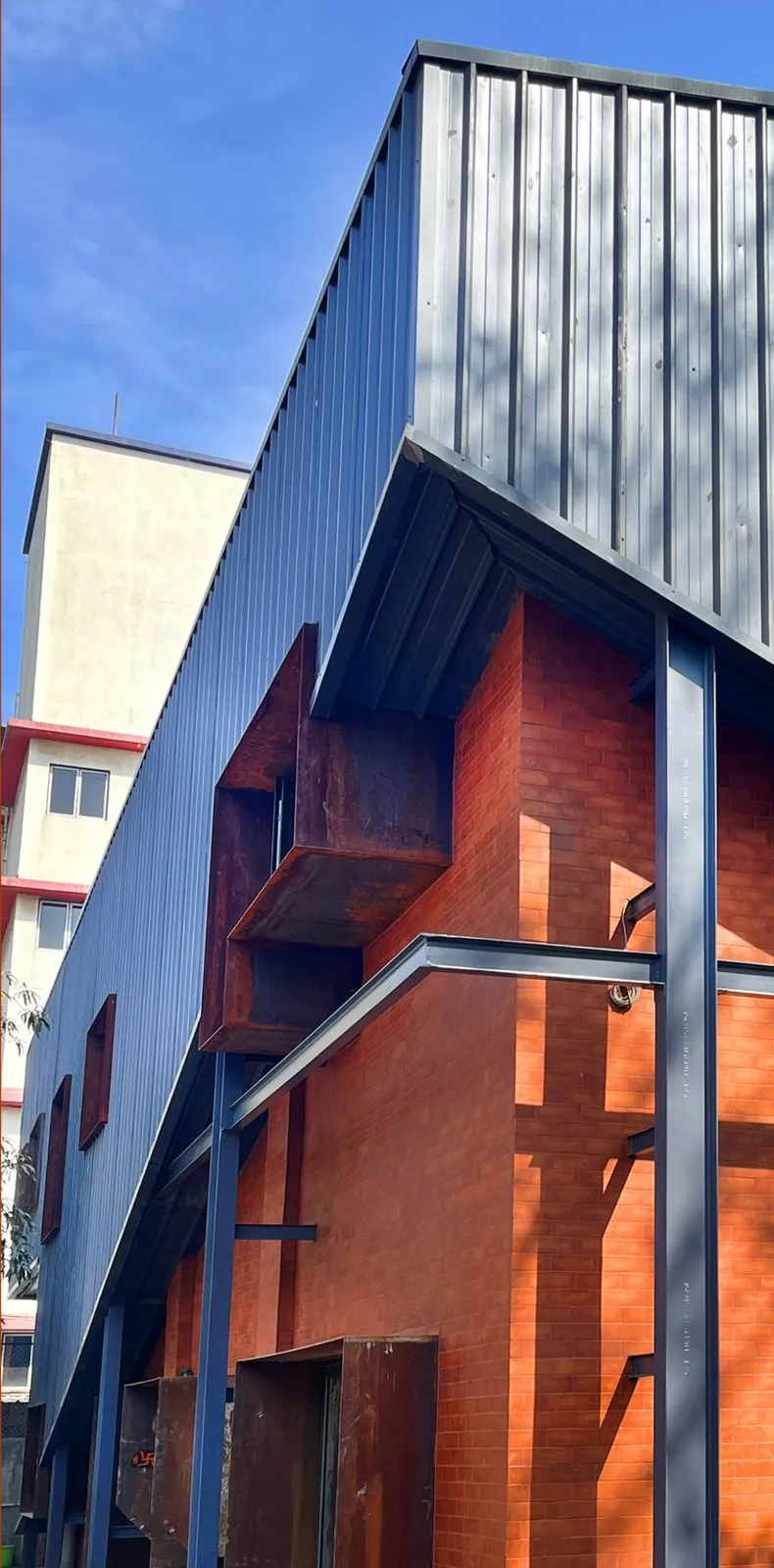The Barn: The brick frontage under the corrugated shell