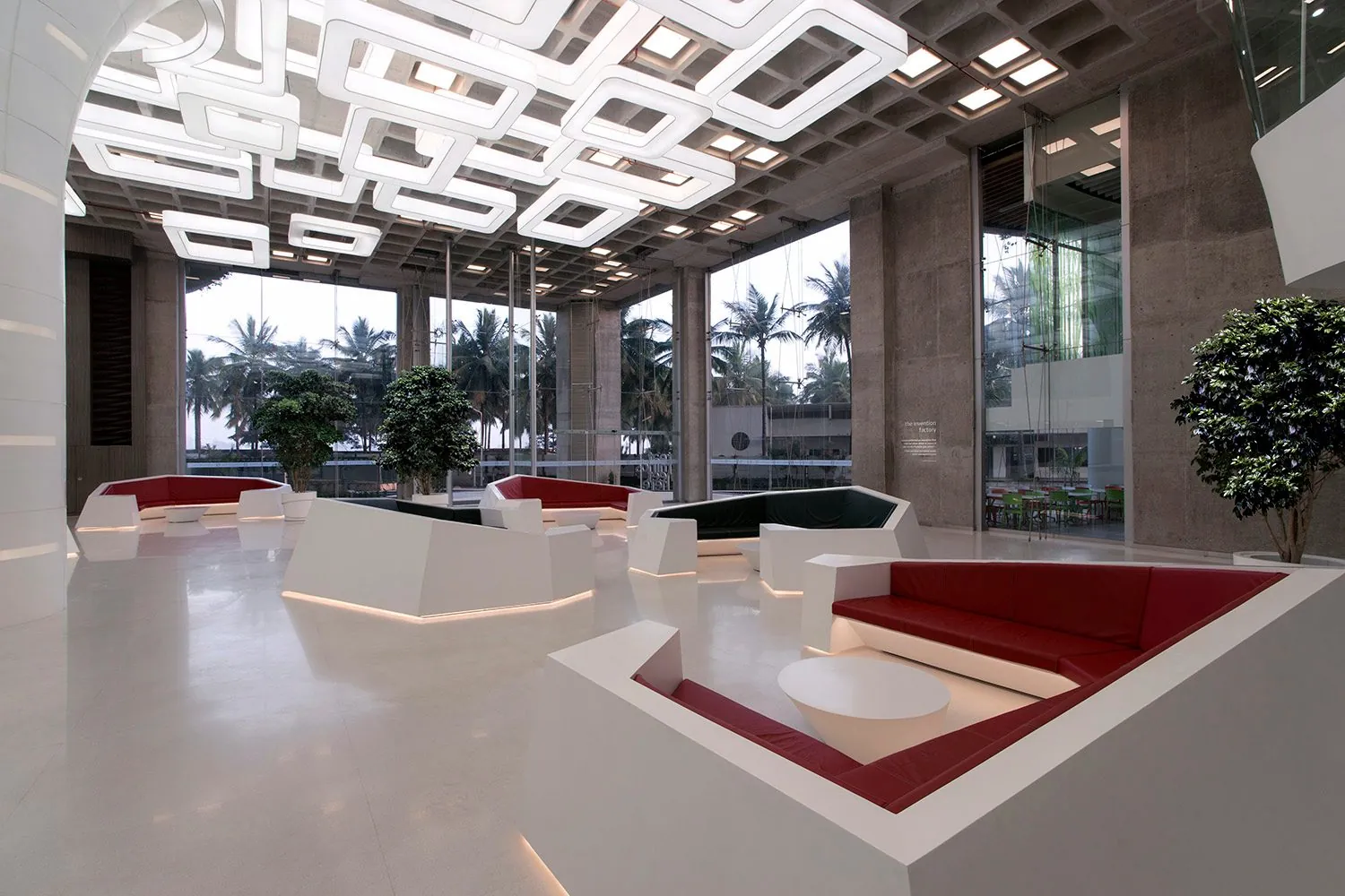 Reflected Topography: Seating clusters under the waffle-slab luminaires