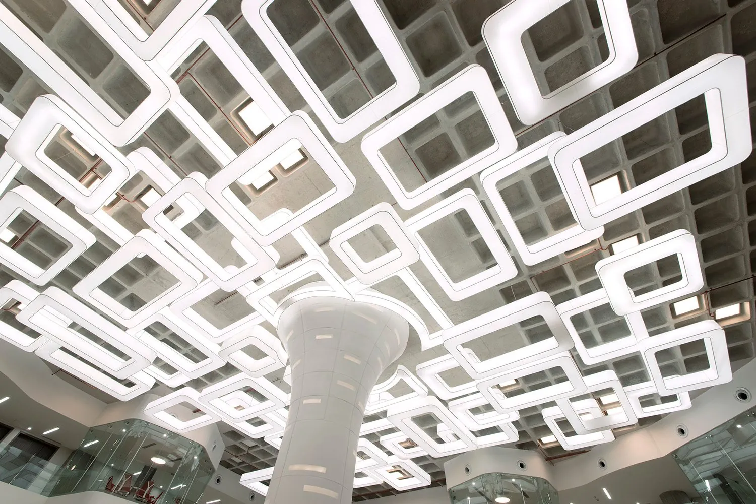 Reflected Topography, Bengaluru, India: The lit waffle slab and the central column, seen from below